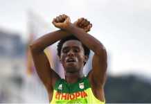 Feyisa Lilesa - For Oromo [Iimage source: Oliver Morin/AFP/Getty Images], crowd ink, crowdink, crowdink.com, crowdink.com.au