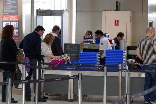 Passengers going through airport security (Image Source: abc), crowdink.com, crowdink.com.au, crowd ink, crowdink