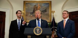President Donald Trump- RAISE Act (Image Source: The Atlantic) President Donald Trump, flanked by Senators Tom Cotton, left, and David Perdue, speaks in the Roosevelt Room of the White House on August 2, 2017, during the unveiling of the RAISE Act. crowdink.com, crowdink.com.au, crowdink, crowd ink
